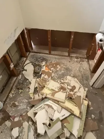 Bathroom stripped to the studs after a sewage backup cleanup